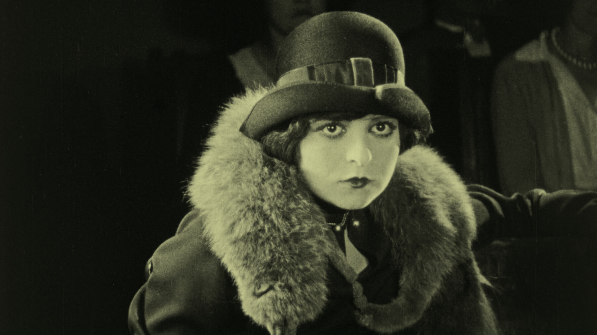 A mono still from the film showing a head and shoulders shot of the heroine.