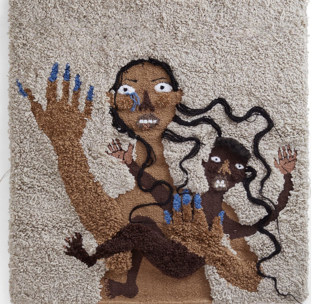 Anya Paintsil’s artwork God Will Punish Him, a hand hooked large scale textile piece made using traditional rug fabrication techniques, depicting an adult with long loose hair holding a child in one arm, the other arm raised forwards – a bright blue tear falling from their eye matches the blue of their nails.
