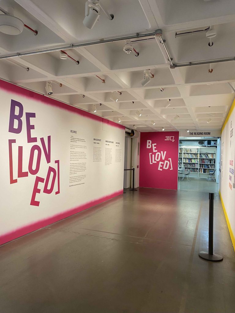 a colour photograph of the walls outside Gallery 5 at Arnolfini. The words BeLoved are emblazoned on the walls in huge letters.