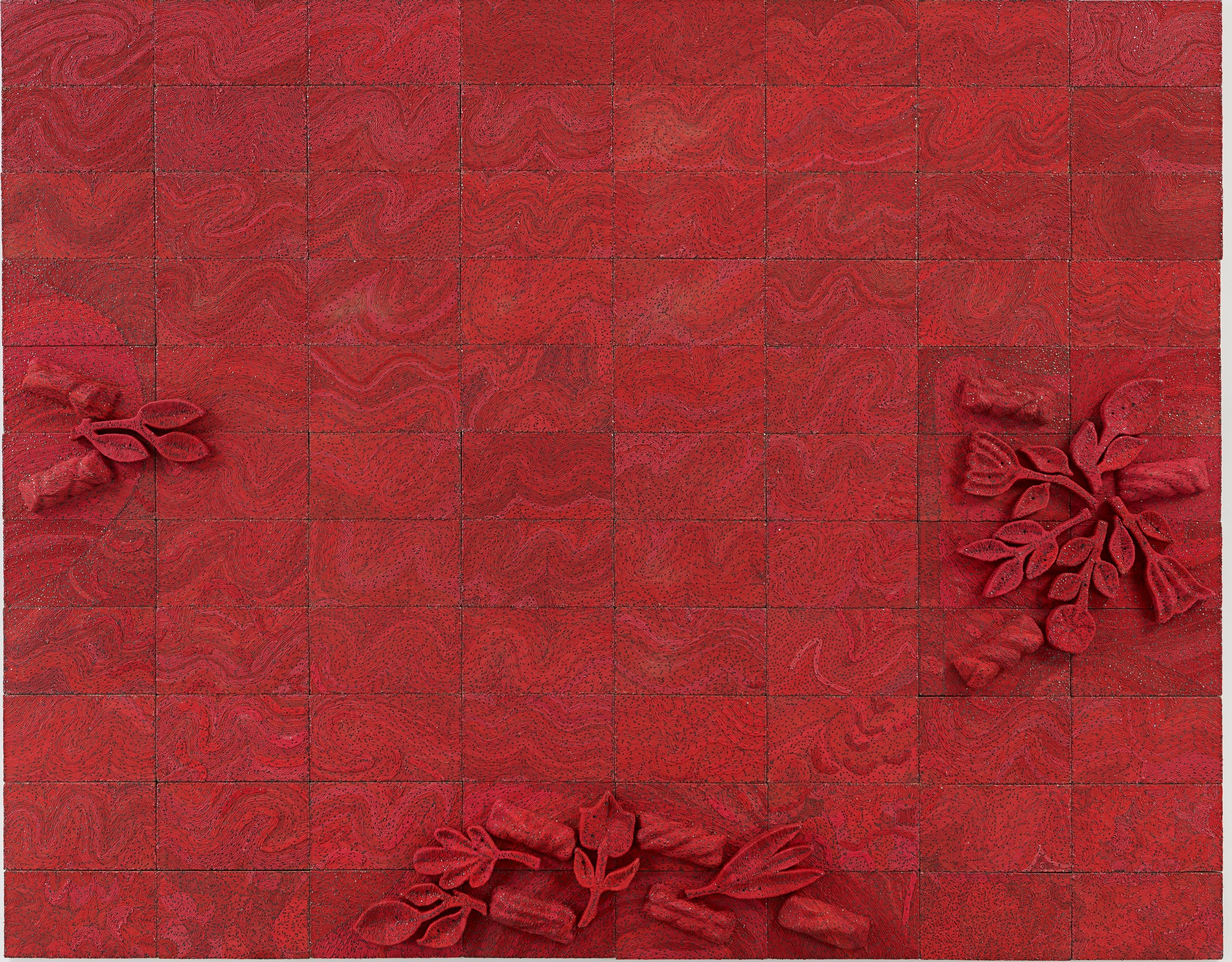 A coloured photograph of Elias Sime’s work called Tightrope: It is Green 8. A bright earthy shade of red wall-based work that is made from electrical wires on a panel, with floral reliefs on the bottom center, left and right end of the panel.