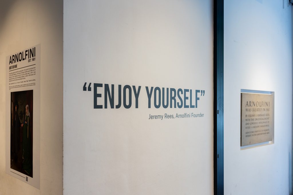 a colour photggraph of the words 'Enjoy Yourself' Jeremy Reeds, Arnolfini Founder by the door in the foyer space at Arnolfini
