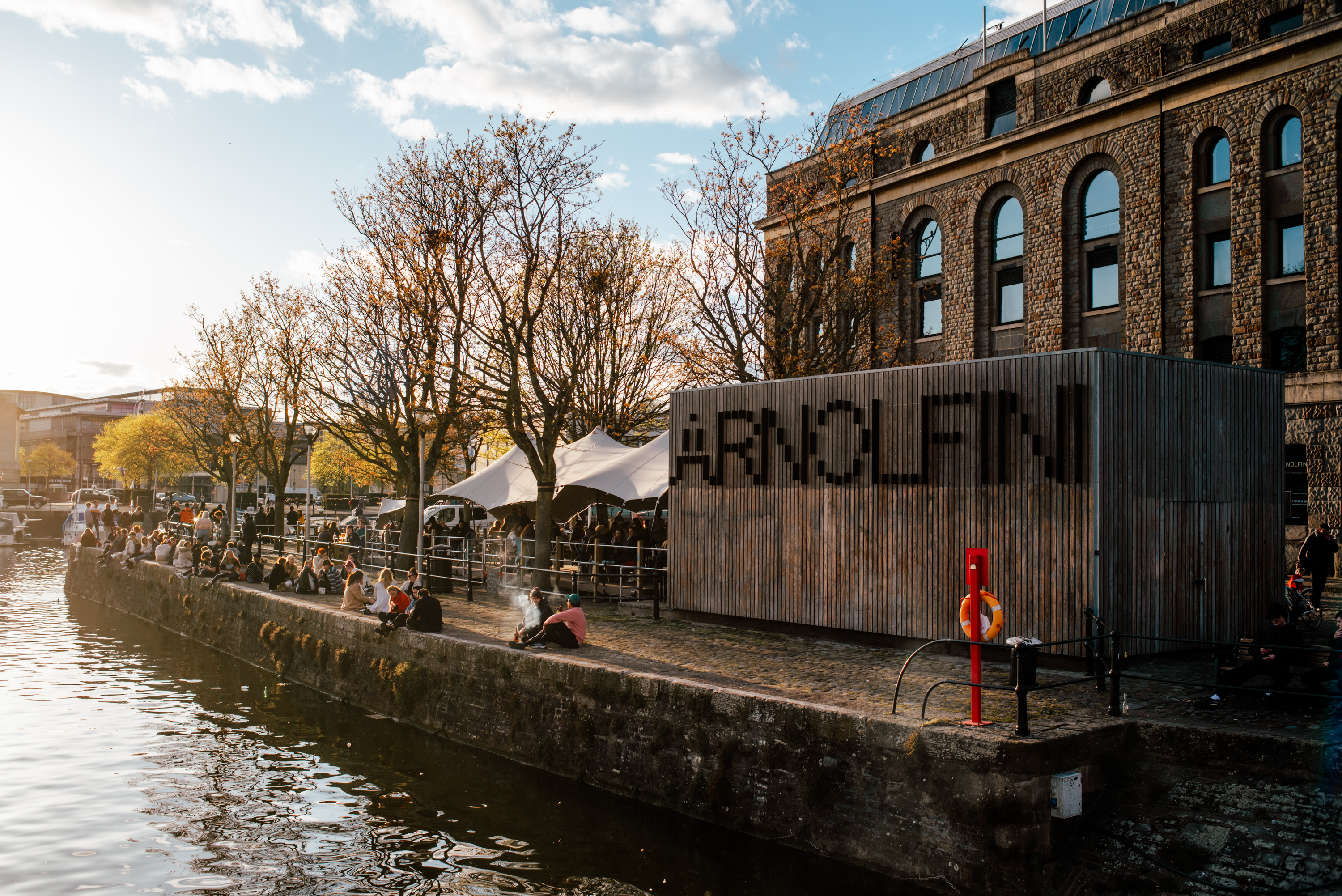 an exterior image of Arnolfini looking onto the front of the building that overlooks the Harbour