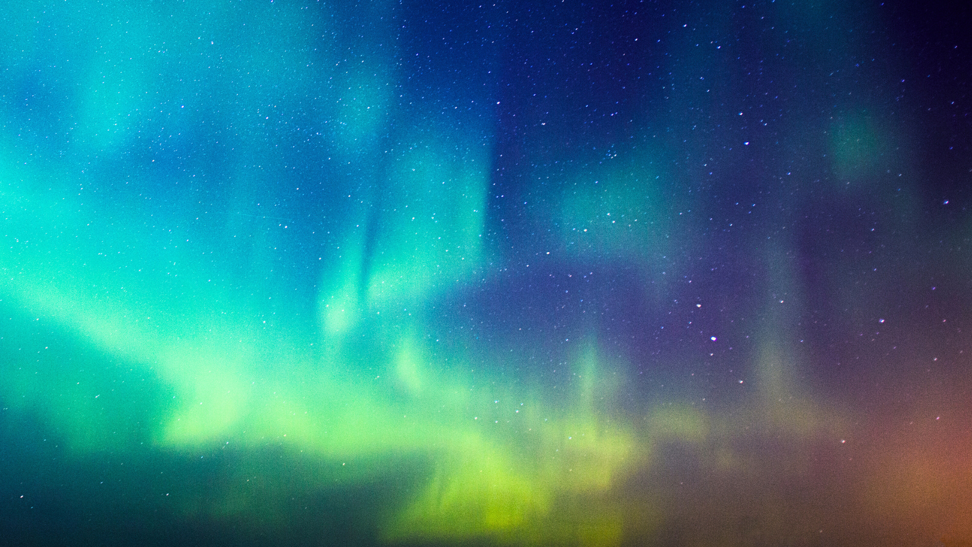 An image of the night sky illuminated by the northern lights.