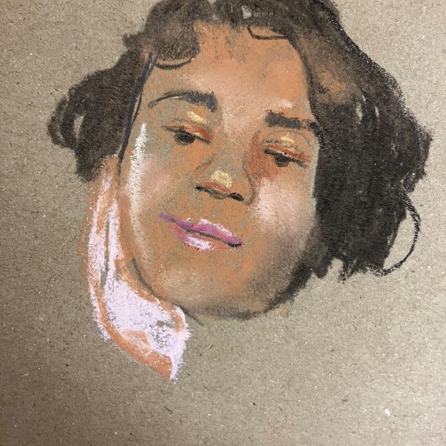 a coloured pastel drawing of a face on brown paper.
