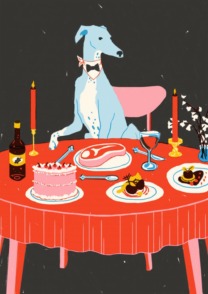 a colourful illustration of a slim, light blue greyhound type dog, wearing a black bow tie. The dog is sat at a dinner table with a bright red table cloth. On the table are two candles and a selection of food including a steak and cake, as well as a bottle of drink.